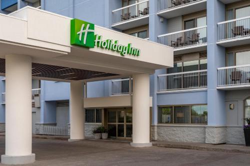 a large building with a sign on the side of it at Holiday Inn Kingston - Waterfront, an IHG Hotel in Kingston