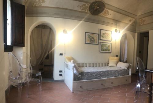 a bedroom with a bed in the corner of a room at Little Liberty Loft in Barberino di Mugello