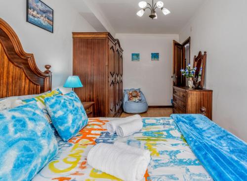 a bedroom with a bed with two pillows on it at Apartment Rustic Oporto in Porto