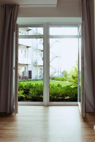 an open door with a view of a building at Das Loft Apartments in Aachen