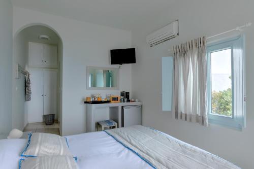 Cama o camas de una habitación en Blue Dolphins Apartments
