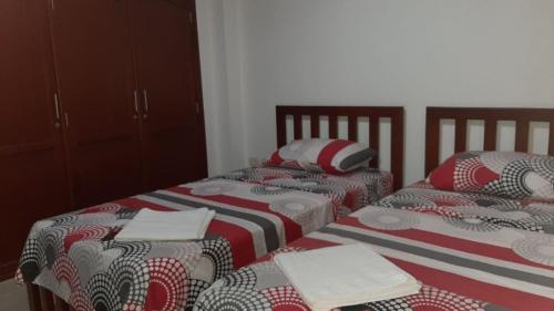 Cama o camas de una habitación en Hospedaje Tuuma