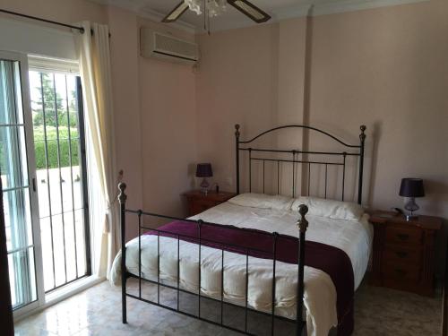 Ένα ή περισσότερα κρεβάτια σε δωμάτιο στο Casa Felicidad