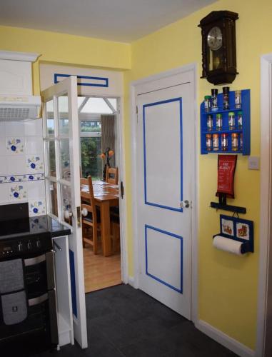 a kitchen with a door leading to a dining room at Great base for a Yorkshire adventure in Old Malton