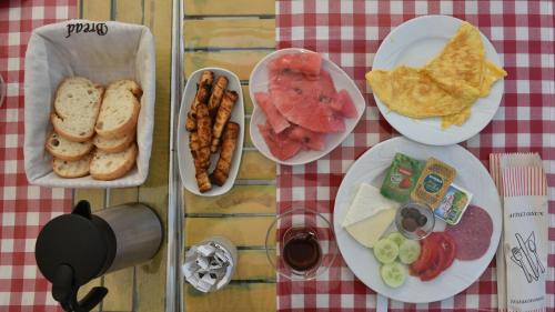 three plates of food on a table with breakfast foods at R HOUSE HOTEL in Bodrum City