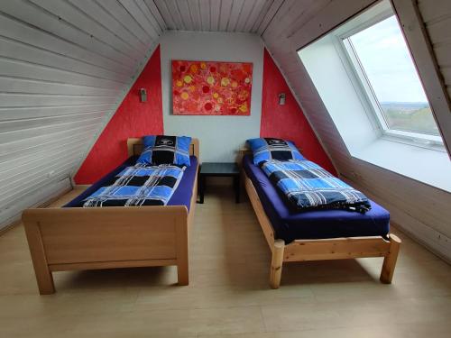 Postel nebo postele na pokoji v ubytování Ferienwohnung in der Mainleite für Vier