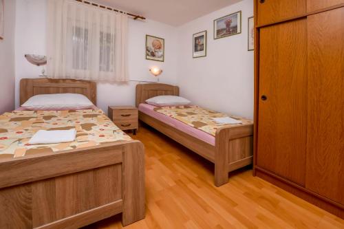Posteľ alebo postele v izbe v ubytovaní Apartments Cvitic