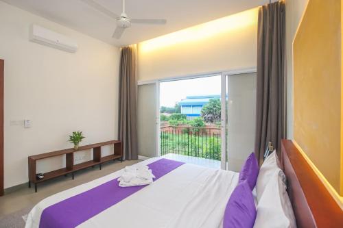 Postel nebo postele na pokoji v ubytování Phan NaTa Apartment