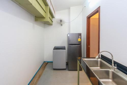 Kuchyň nebo kuchyňský kout v ubytování Phan NaTa Apartment