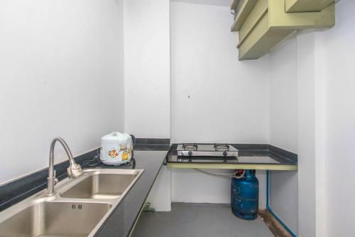 Kuchyň nebo kuchyňský kout v ubytování Phan NaTa Apartment