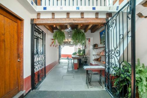 a hallway of a house with an iron gate at Hotel Valle Bonito, Valle de Bravo in Valle de Bravo