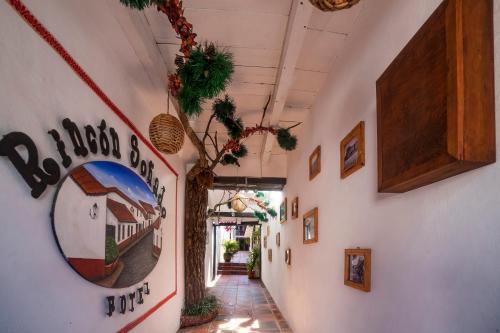 a hallway in a building with a sign on the wall at Hotel Rincon Soñado, Valle de Bravo in Valle de Bravo