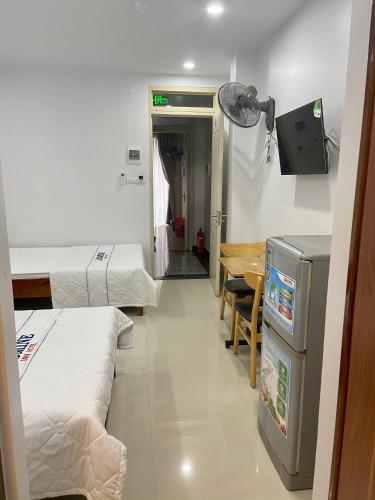 Una televisión o centro de entretenimiento en Jasmine Mini Hotel