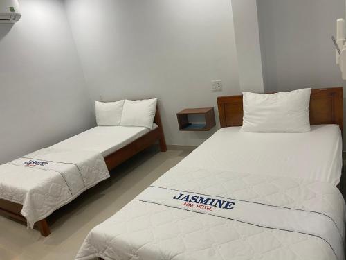 Cama o camas de una habitación en Jasmine Mini Hotel