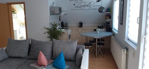 a living room with a couch and a table at Am Bahnhof in Hochkirch