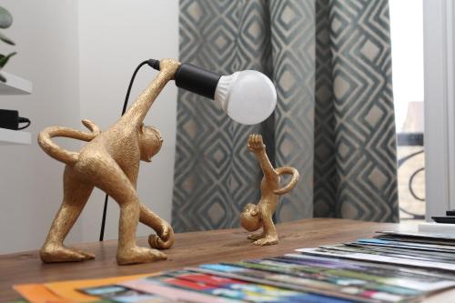 a toy monkey with a microphone on a table at Cocoon Retreat in Chantilly