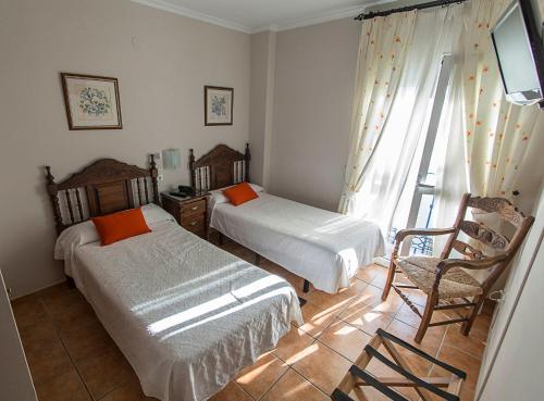 Postel nebo postele na pokoji v ubytování Hostal Marissal by Dorobe