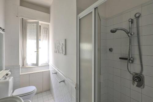 a bathroom with a shower and a toilet at A Due Passi Dal Mare in Lido di Camaiore