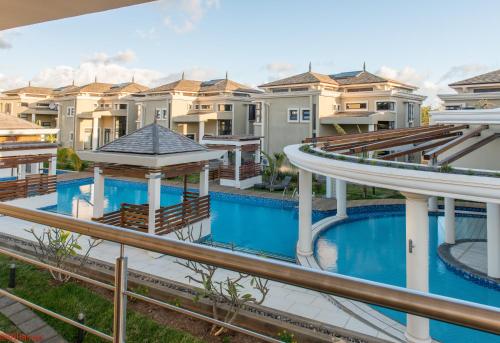 arial view of a house with a swimming pool at Villasun Luxury Apartments & Villas in Flic-en-Flac