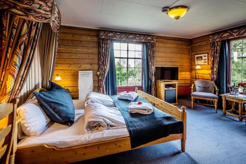 Postel nebo postele na pokoji v ubytování Straand Hotel