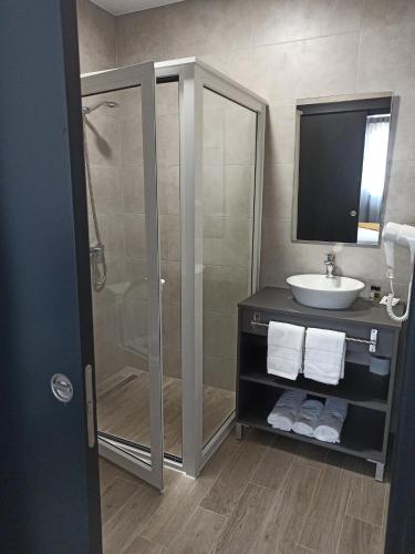 a bathroom with a shower and a sink at Porto D'Abrigo - Alojamento Local in Sardoal