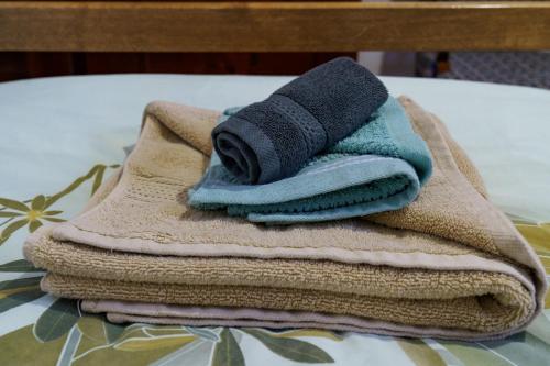 a pile of towels sitting on top of a table at Guest House Tommy Bansko - Bachevo in Bachevo
