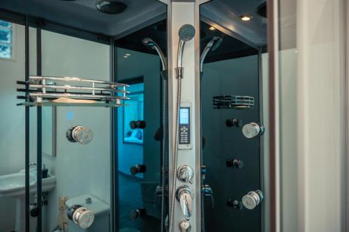 a bathroom with a shower with a glass door at B&B Marranzano in Giardini Naxos