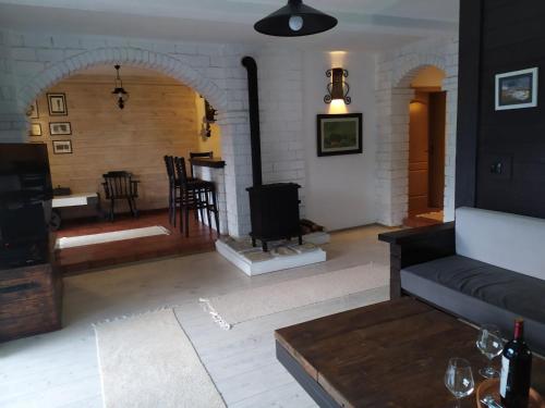 a living room with a couch and a table at Lux Apartment Sunset in Virpazar