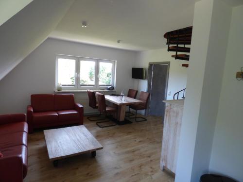 a living room with a couch and a table at Poseidon in Nebel