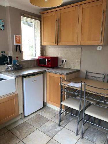 Kuchyň nebo kuchyňský kout v ubytování The Annexe Room Hea Close