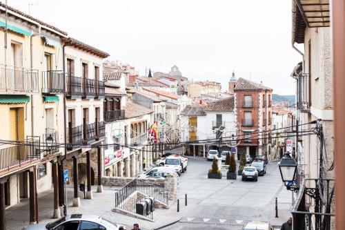 a view of a city street with cars parked at Casa Rural Tio Mora in Horche