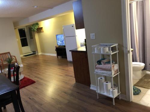 a room with a kitchen and a living room at Spacious 2 Bedroom guest suite in Toronto