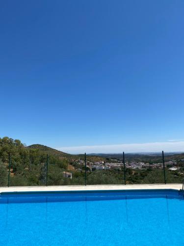 a swimming pool with a view of the ocean at El Molino de La Quinta in Constantina