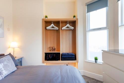 a bedroom with a bed and a window at Beautiful, Entire Luxurious One Bedroom Flat in Leicester