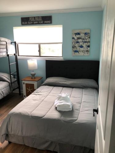 a bedroom with a bed with a white towel on it at Vacation Bliss LLC in Hilton Head Island