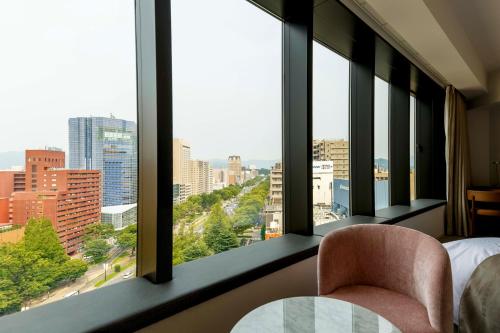 a hotel room with a view of a city at THE KNOT HIROSHIMA in Hiroshima