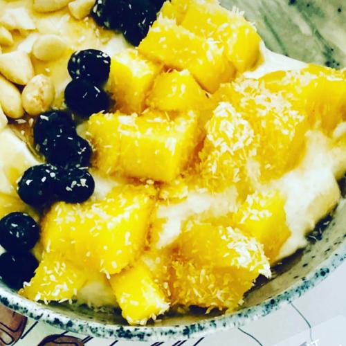a plate of food with fruit on a table at Meltemi in Skiathos Town