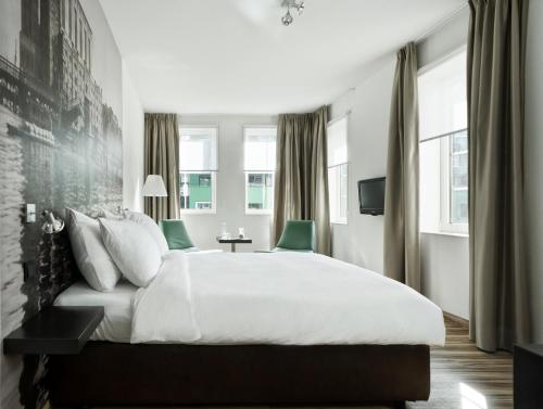 Postel nebo postele na pokoji v ubytování Inntel Hotels Amsterdam Zaandam