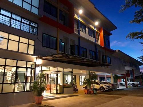 a building with a car parked in front of it at Kradang Nga Boutique Inn in Khun Han