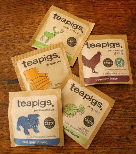four packets of teapots on a wooden table at Aylworth Manor in Naunton