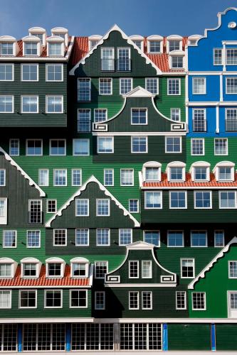 a picture of a building with houses painted on it at Inntel Hotels Amsterdam Zaandam in Zaandam