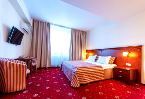 Postel nebo postele na pokoji v ubytování Hotel Minerva