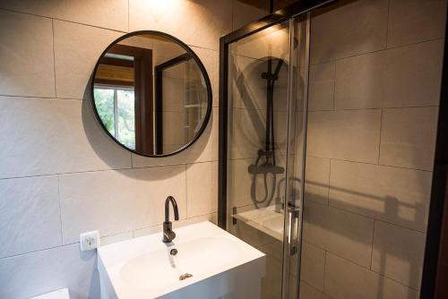 a bathroom with a sink and a mirror at Casa Castor, Fábrica, Cacela Velha. in Vila Nova de Cacela
