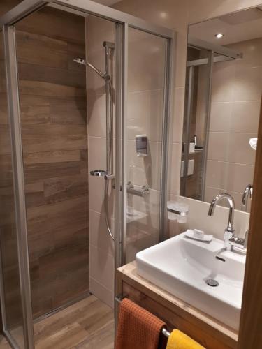 a bathroom with a shower and a sink at Pension Winnebach in Längenfeld