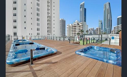 a hot tub on the roof of a building at Surfers Ocean View Sleeps 4, Free WIFI, Washing Machine, Large Fridge in Gold Coast