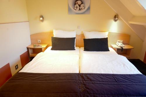 Una habitación en OKE HOTEL De Leygraaf Heeswijk Dinther