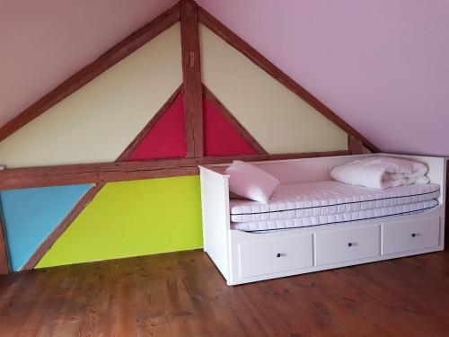 Una cama o camas en una habitación de Espace Cosmos