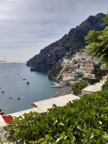 a view of a beach with boats in the water at Da Nonna Nicoletta in Furore