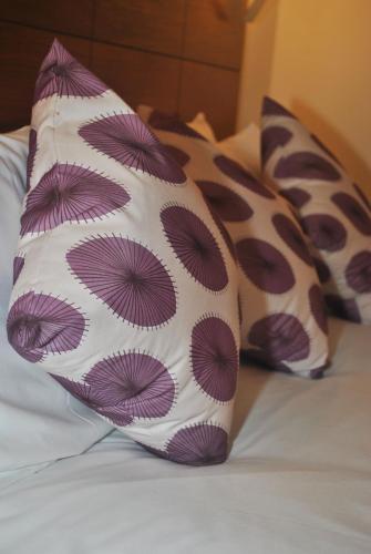 a pillow sitting on top of a bed at Legacy Preston International Hotel in Preston