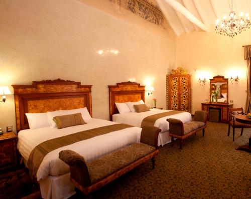Postel nebo postele na pokoji v ubytování Aranwa Cusco Boutique Hotel